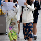 Two high-school seniors walk while studying, in front of Pungmun Girls High School in Seoul in October 2015.